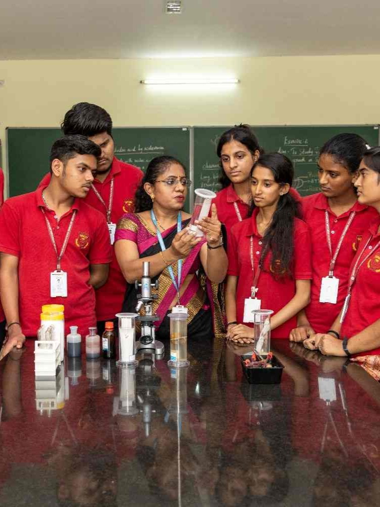 Student using a microscope in the biology lab